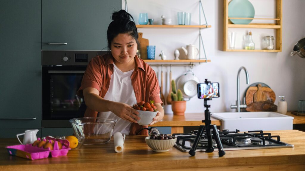 Person filming a cooking video